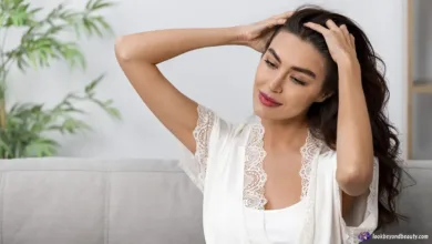 Woman scratching head dry scalp vs dandruff