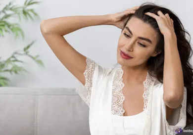Woman scratching head dry scalp vs dandruff